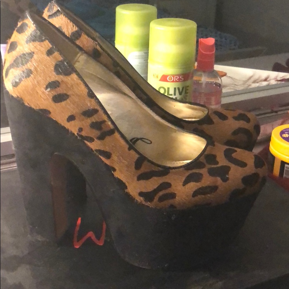 Used pair of leopard style heels worn three times.